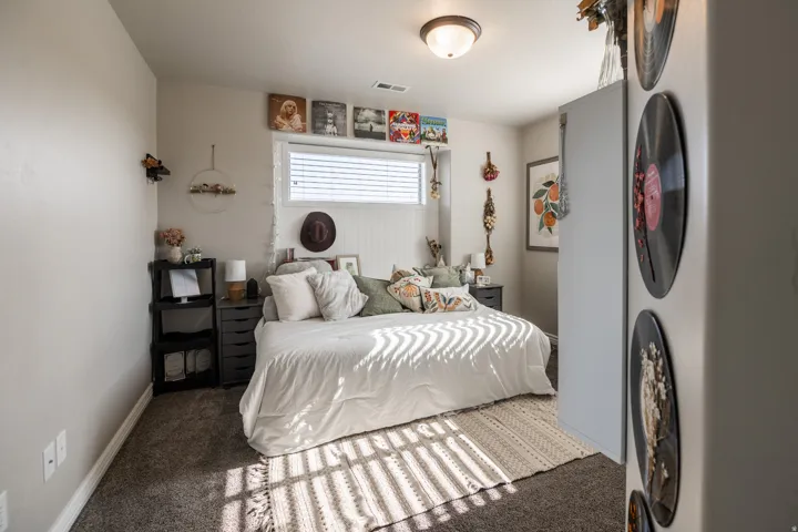 Recessed window with horizontal blinds, shiplap accent wall, and a flush mount ceiling light fixture