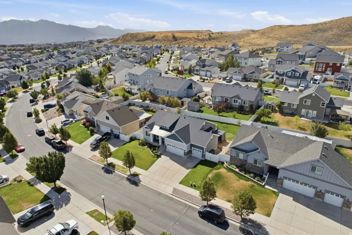 Neighborhood featuring a variety of residential properties, paved streets, and green landscaping