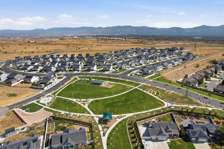 Expansive green space featuring walking paths and a covered pavilion