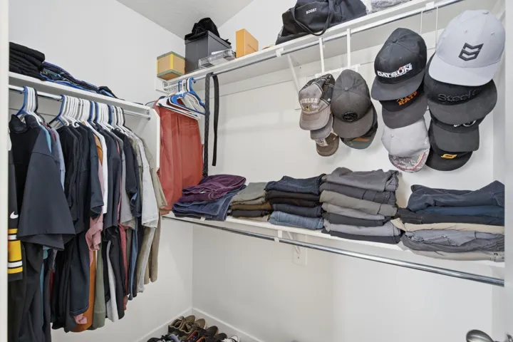 White shelving system with hanging rods