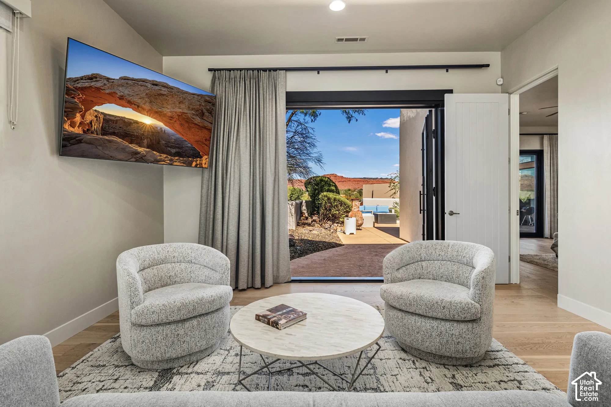 Hardwood-finish flooring, recessed lighting, and a wall-mounted television