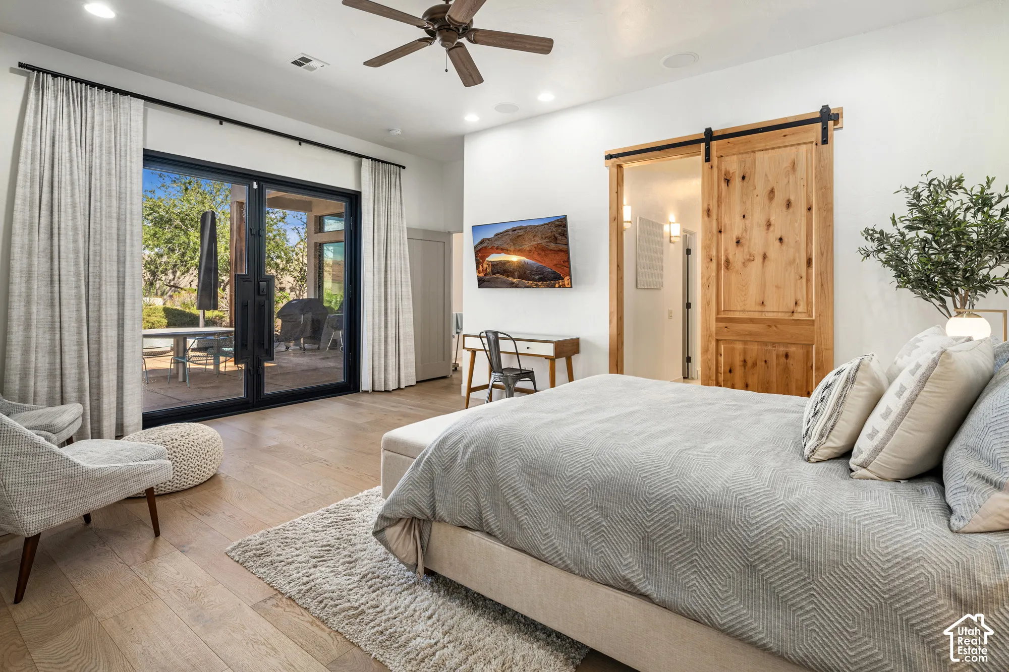 Wood-finish flooring, recessed lighting, and a ceiling fan