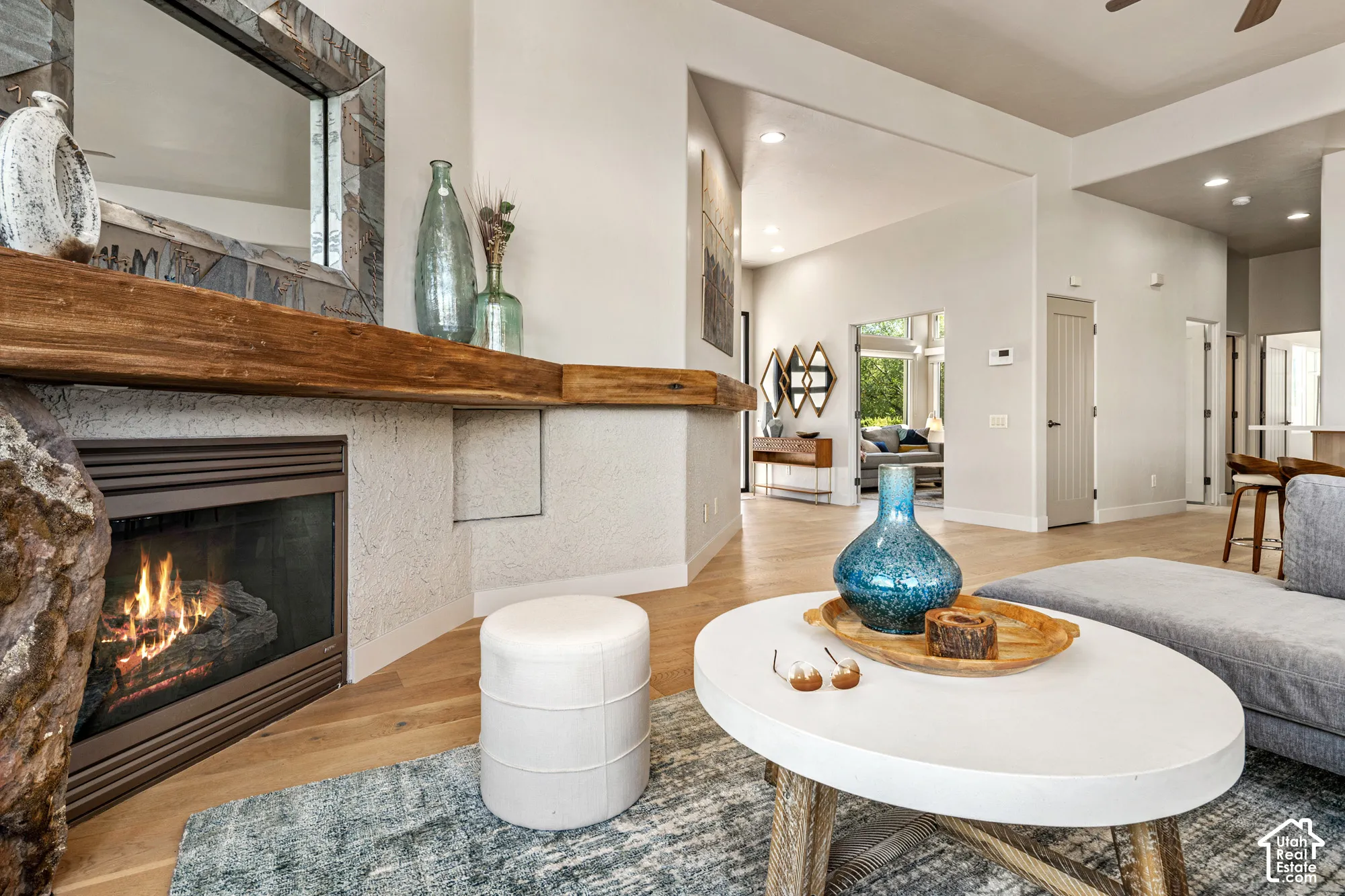 Fireplace with a substantial wood mantle and stone detailing