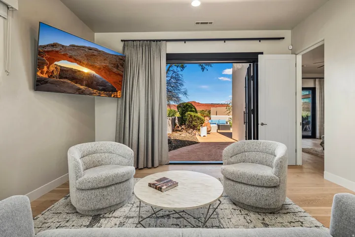 Hardwood-finish flooring, recessed lighting, and a wall-mounted television