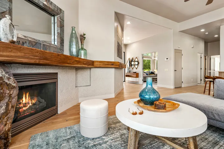 Fireplace with a substantial wood mantle and stone detailing