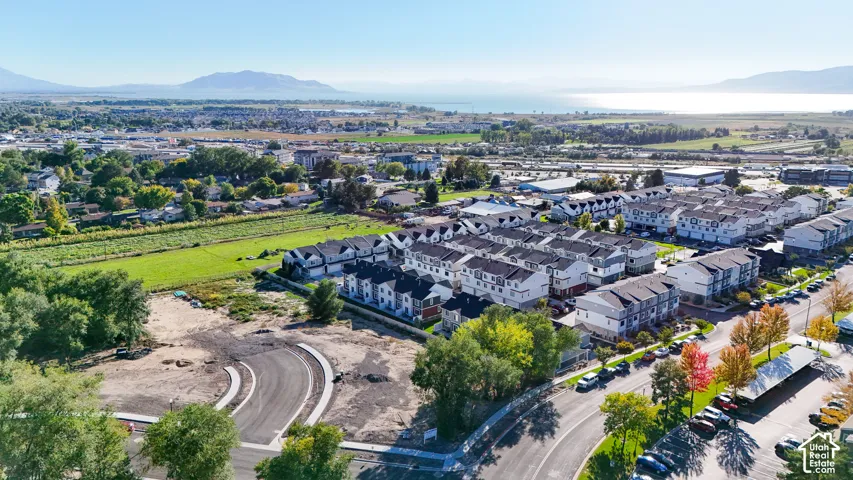 Townhome community with mountain and water backdrop