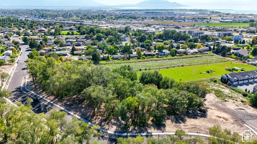 Developing land with paved roads and established residential surroundings