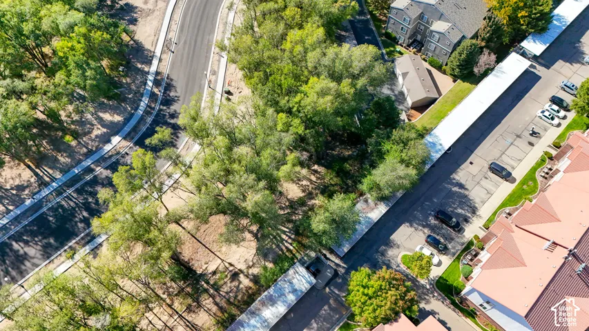 Paved roads, lush trees, and covered parking structures