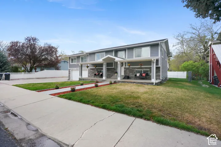 Two-story exterior with gray horizontal siding and white trim