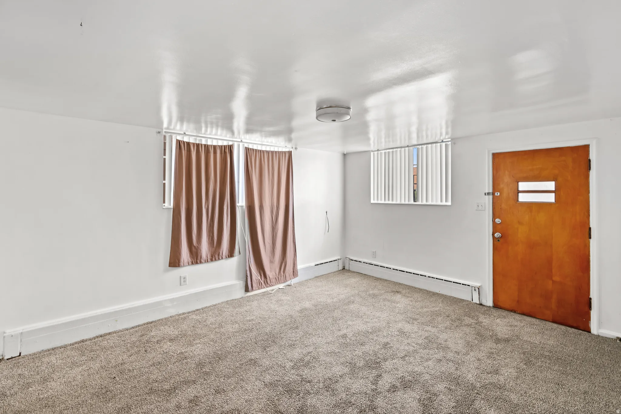 Neutral-toned carpeting paired with white walls