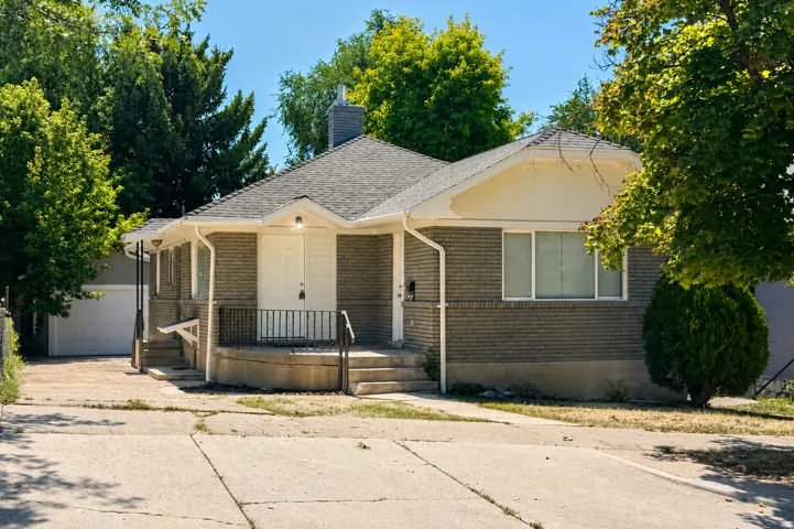 Brick exterior with a gabled roof and white trim
