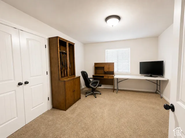 Recessed ceiling light, neutral wall paint, white interior doors, and window with blinds