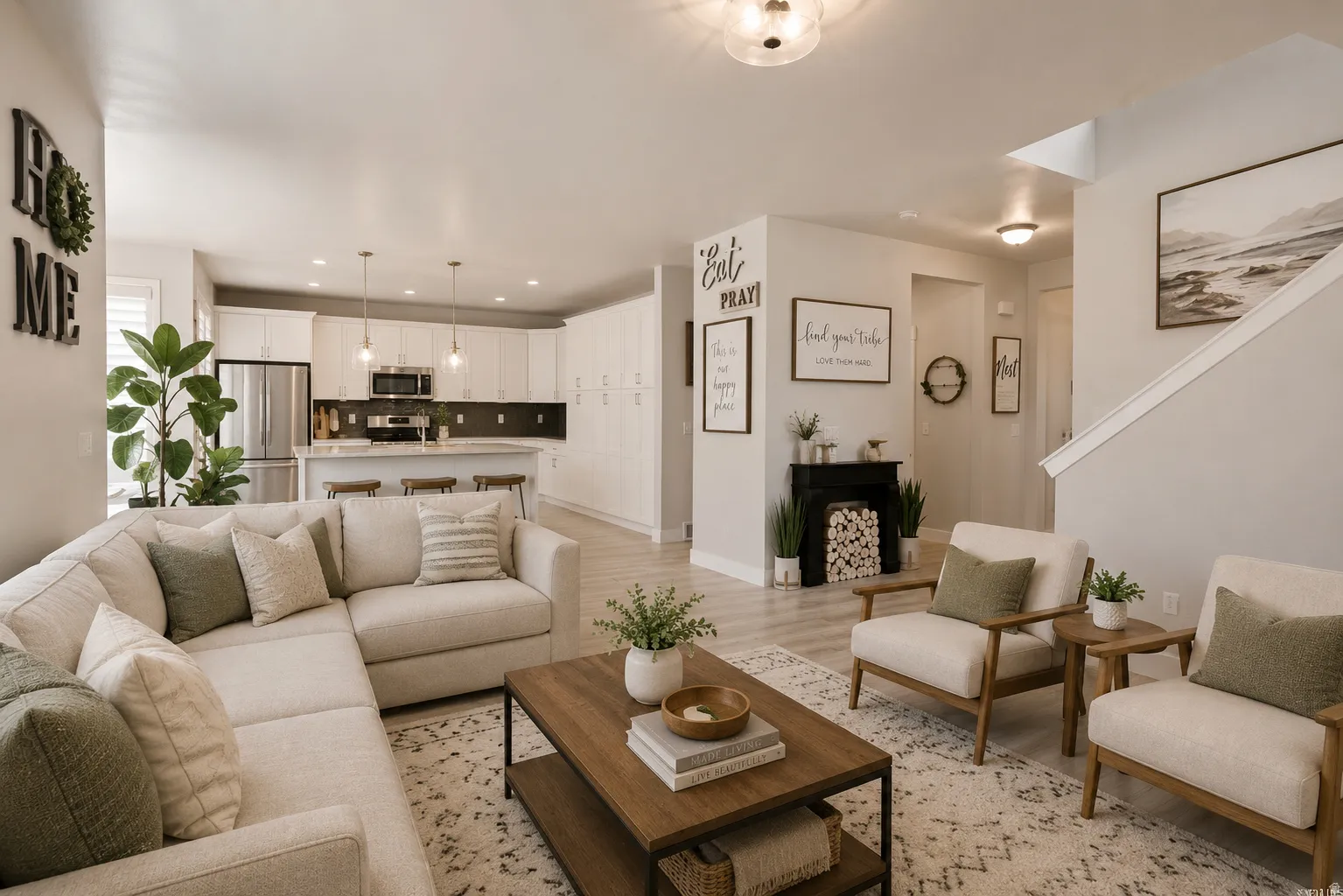 Open-concept living space featuring wood-finish flooring, recessed lighting, and a built-in kitchen island with pendant lighting