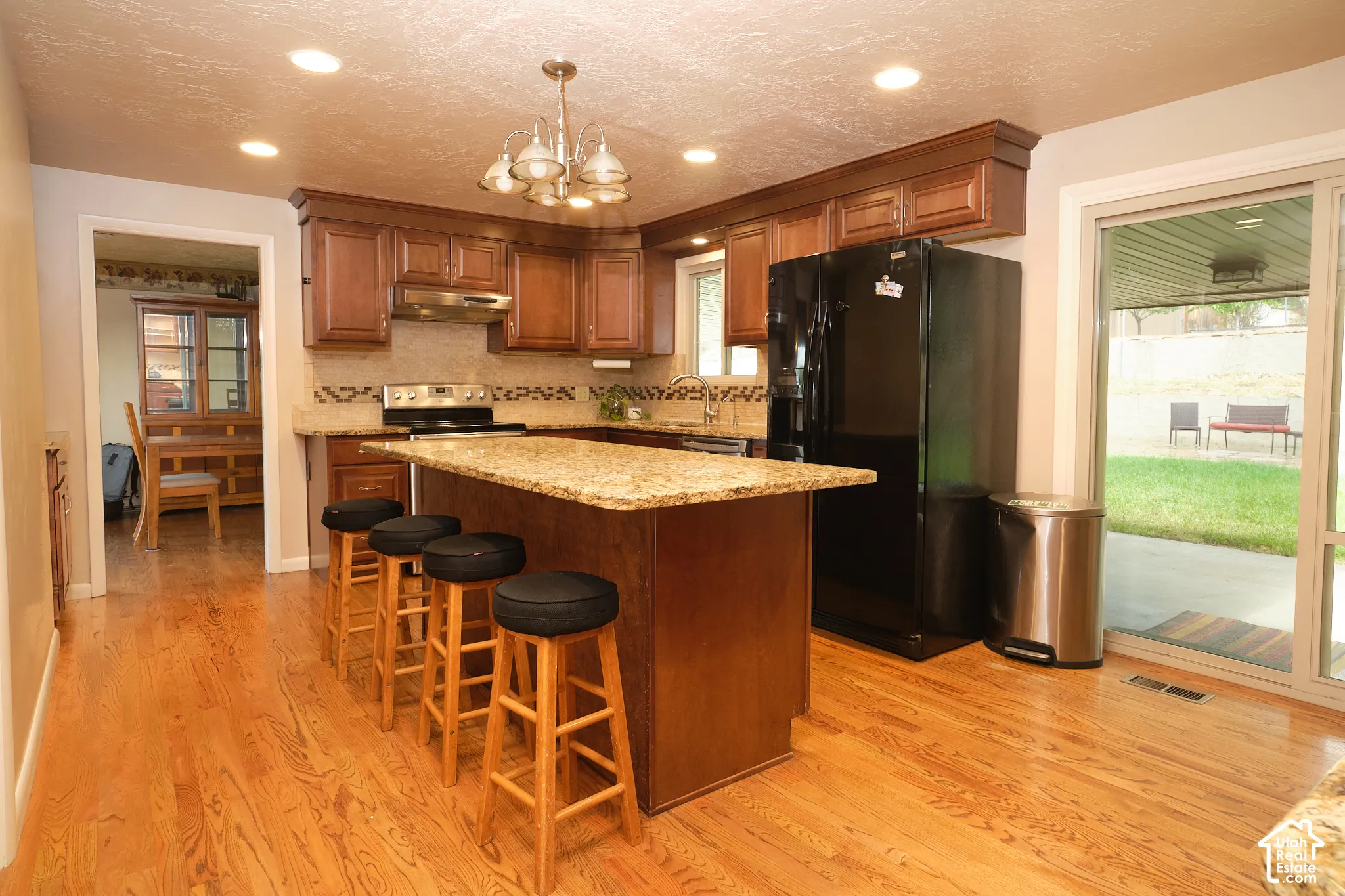 Kitchen featuring a center island with a granite countertop