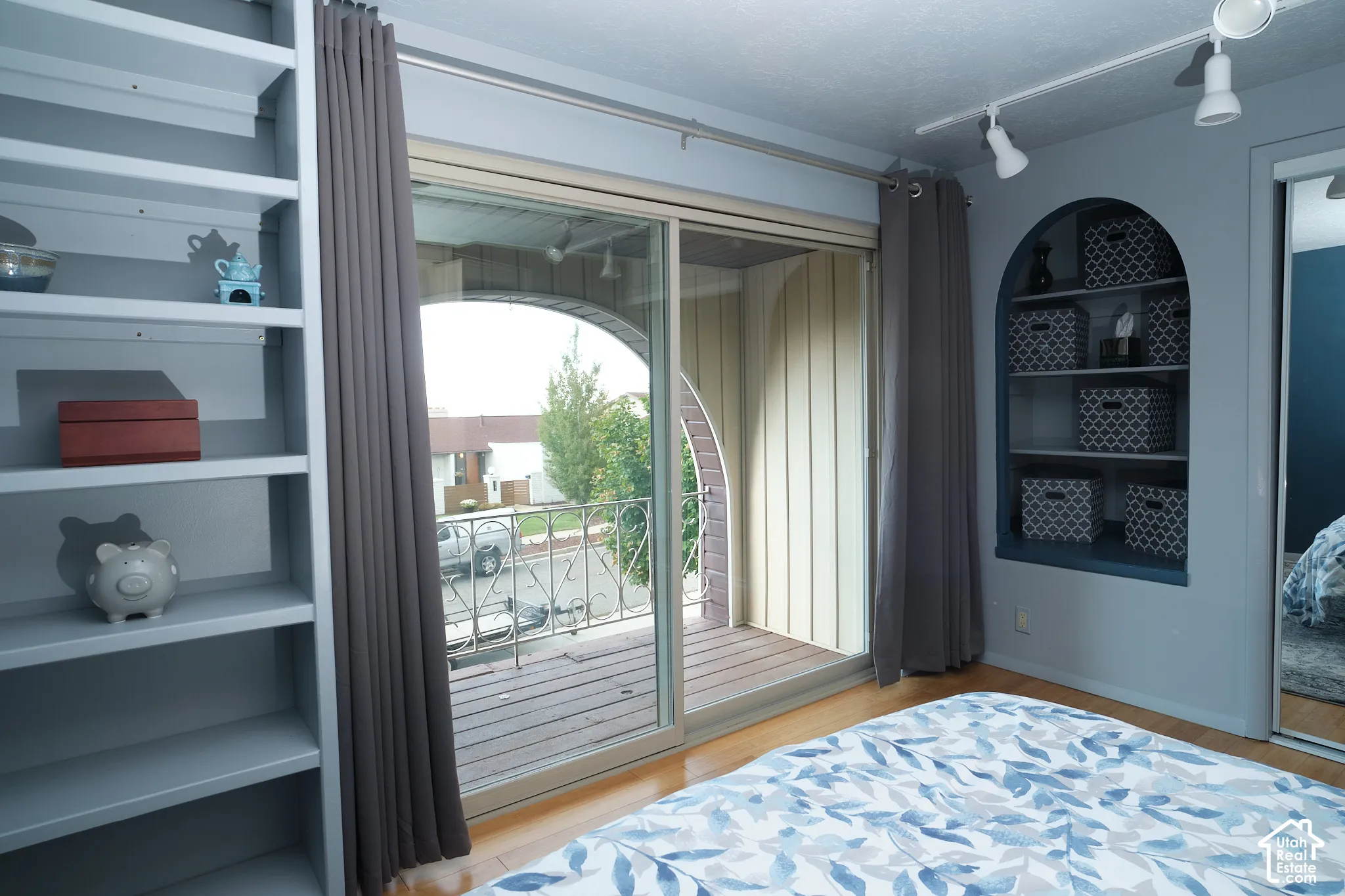 Built-in shelving, glass sliding door.