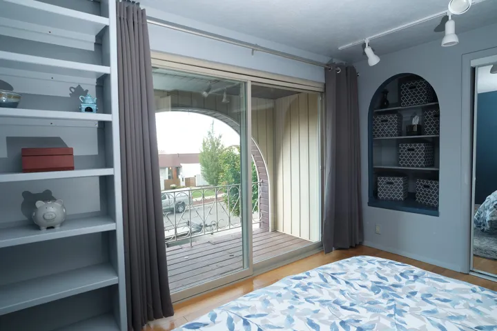 Built-in shelving, glass sliding door.