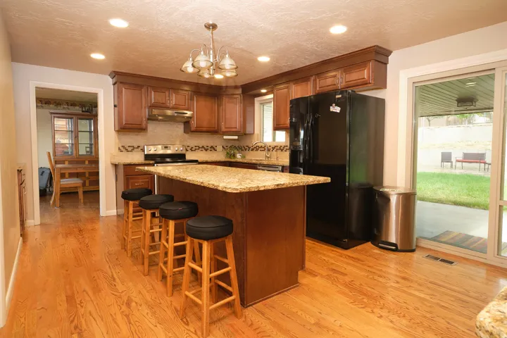 Kitchen featuring a center island with a granite countertop