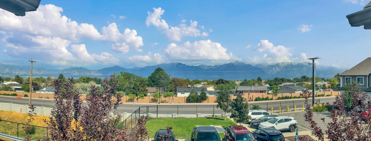 Expansive mountain range and distant lake scenery