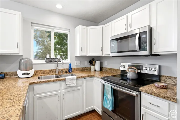 kitchen with built in microwave, electric range