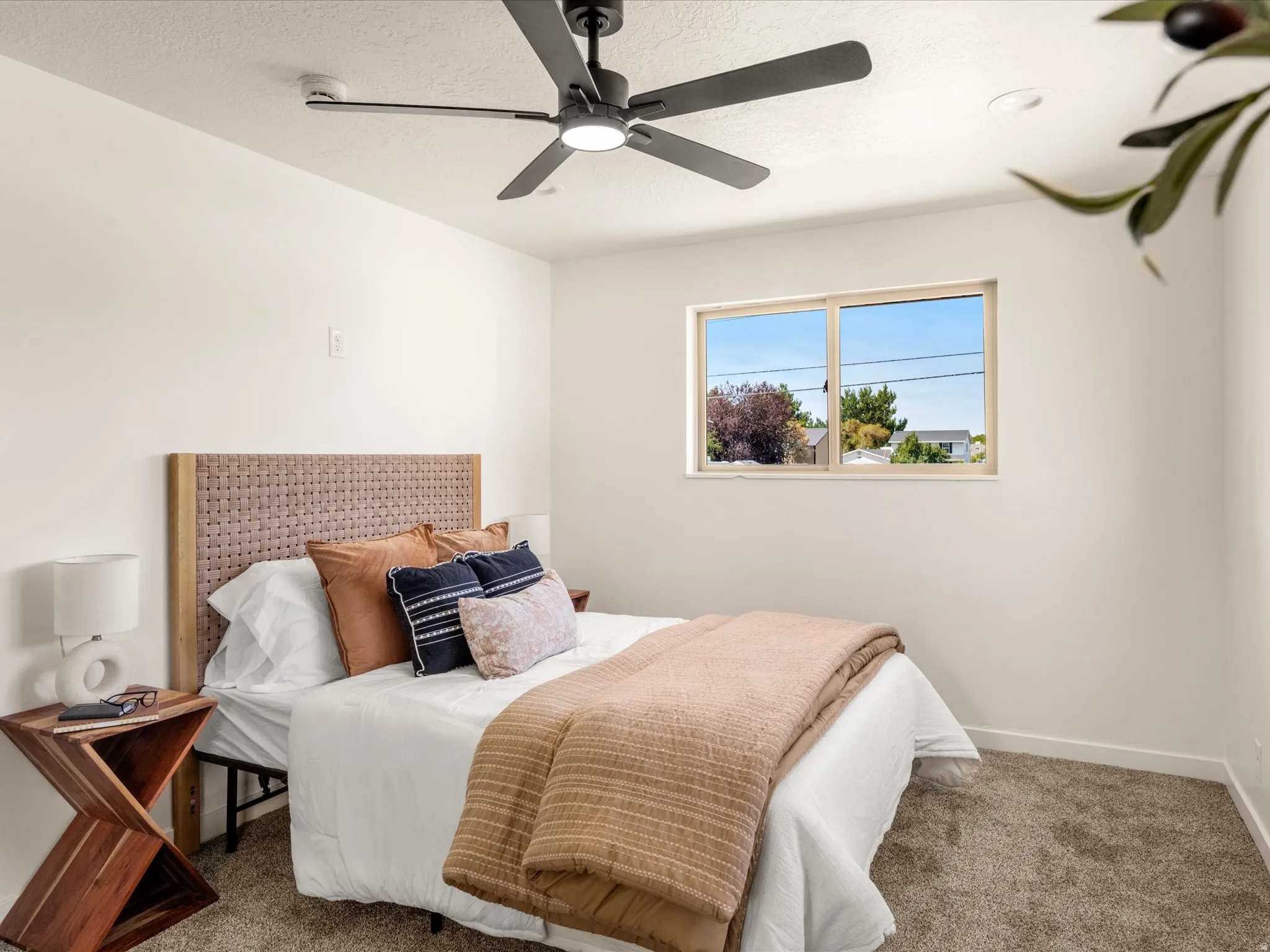 Primary Bedroom. Recessed lighting, ceiling fan, and window offering natural illumination