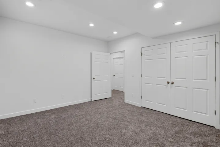 Plush carpeting and white paneled doors