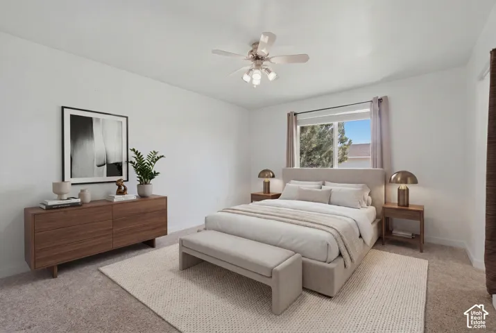 Window with natural light, ceiling fan, and carpeted flooring