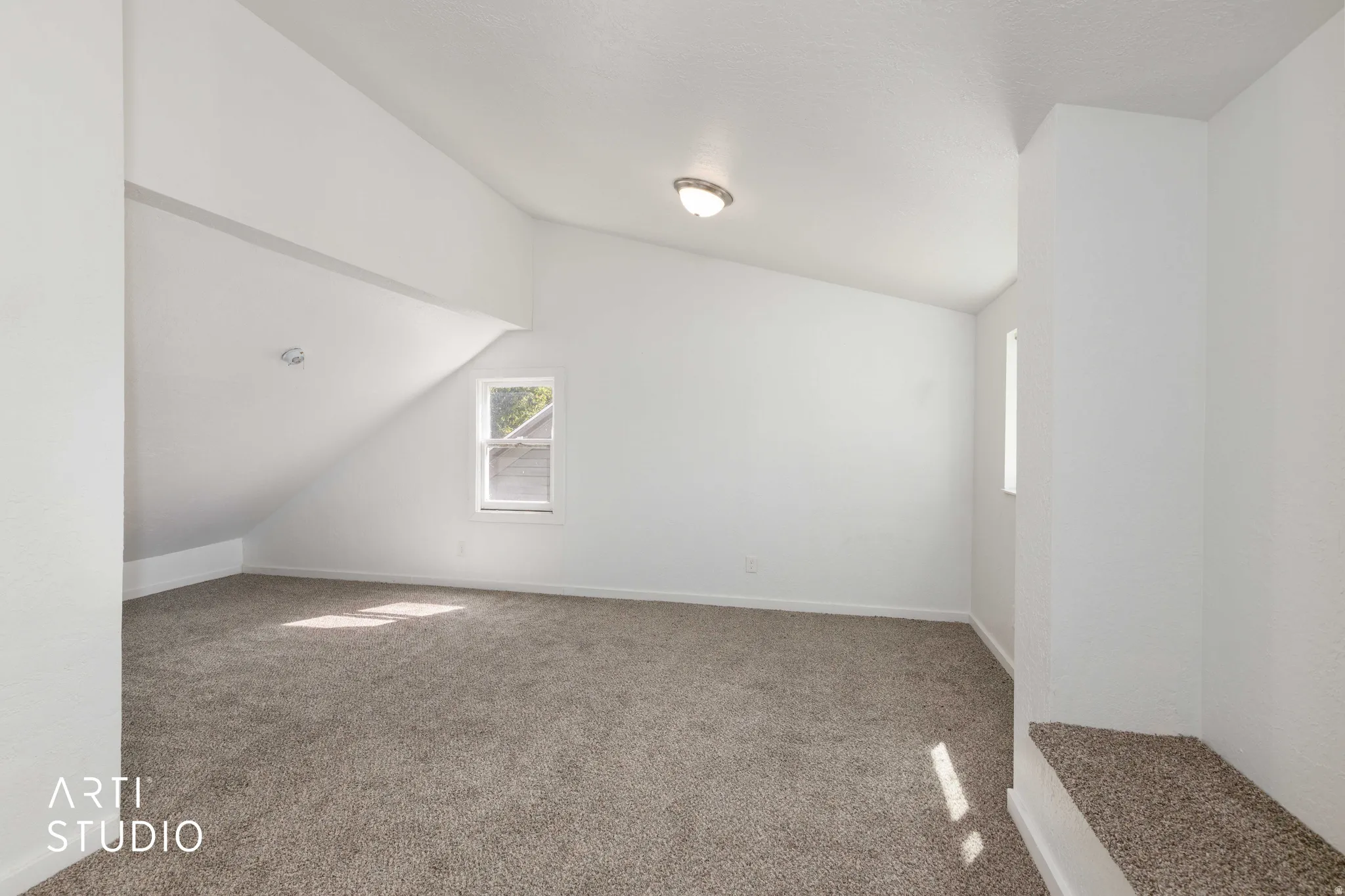 Carpeted flooring with sloped ceilings, recessed lighting, and a flush-mount light fixture