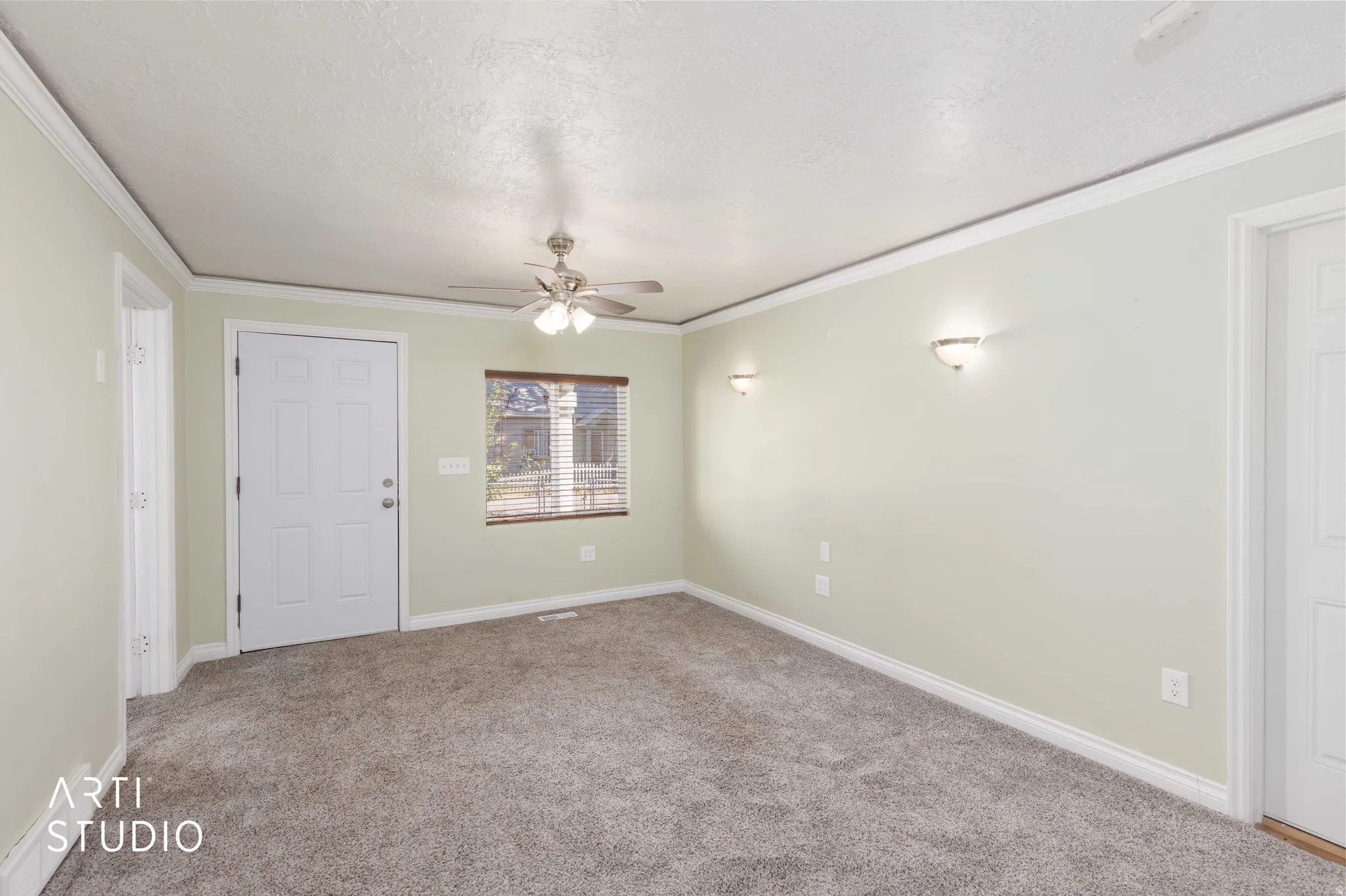Plush carpet flooring, crown molding, white trim, recessed window with blinds, and ceiling fan with integrated lighting