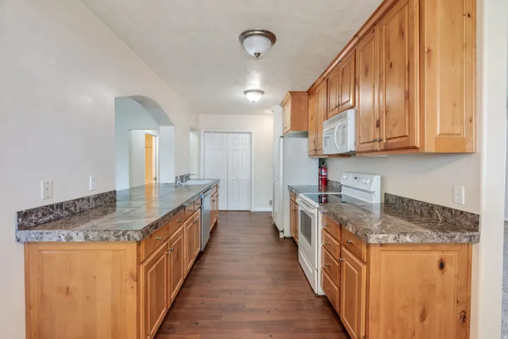 Kitchen featuring wood-finish cabinetry, and full-size appliances