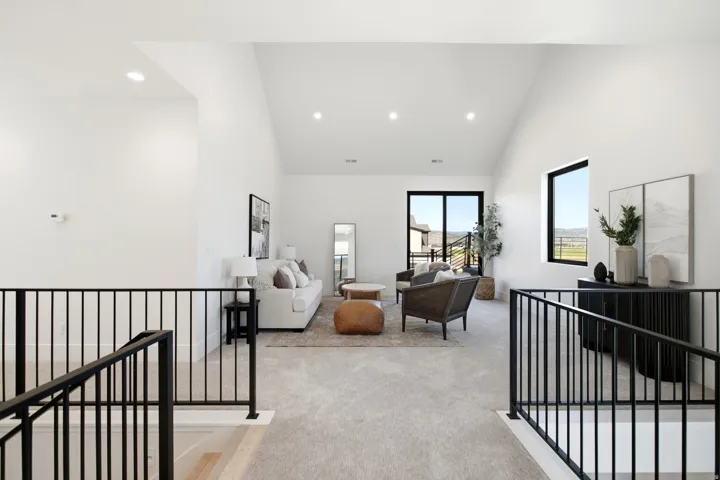 Vaulted ceilings, recessed lighting, and expansive windows