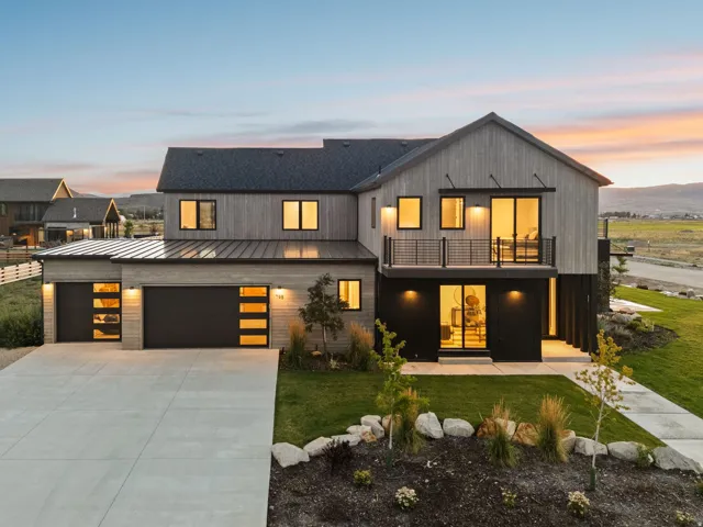 Modern exterior with vertical wood-finish siding and a dark metal roof