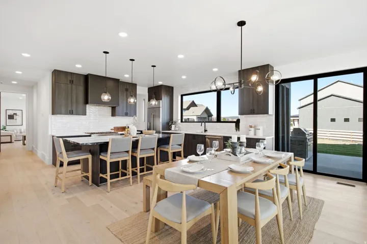 Open concept living area with light wood-finish flooring