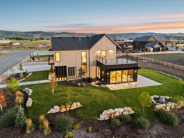Modern architectural residence featuring a wood-clad and dark-paneled exterior