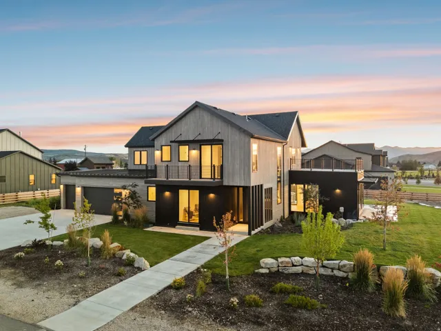 Modern architecture featuring a gabled roofline, mixed-material exterior, and a multi-level design