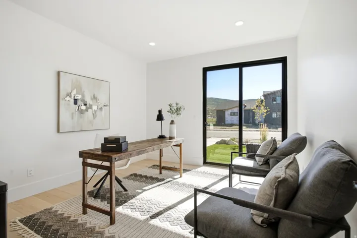Recessed lighting, wood-finish flooring, and white walls