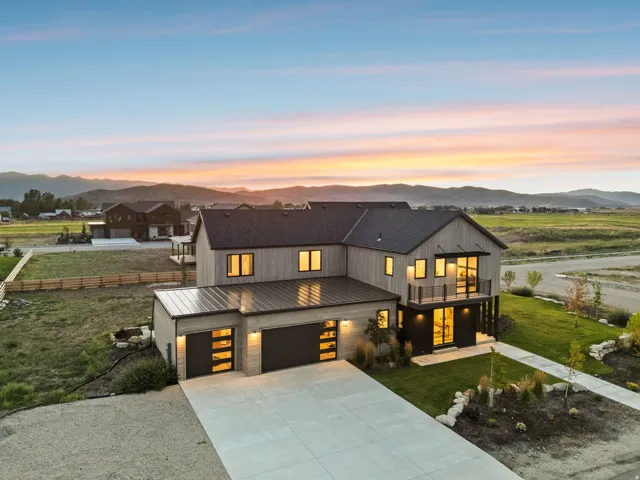 Modern exterior featuring wood-look siding and a dark roof