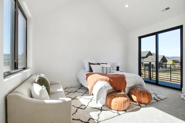 Bedroom 3 of 3 upper level with outdoor access.