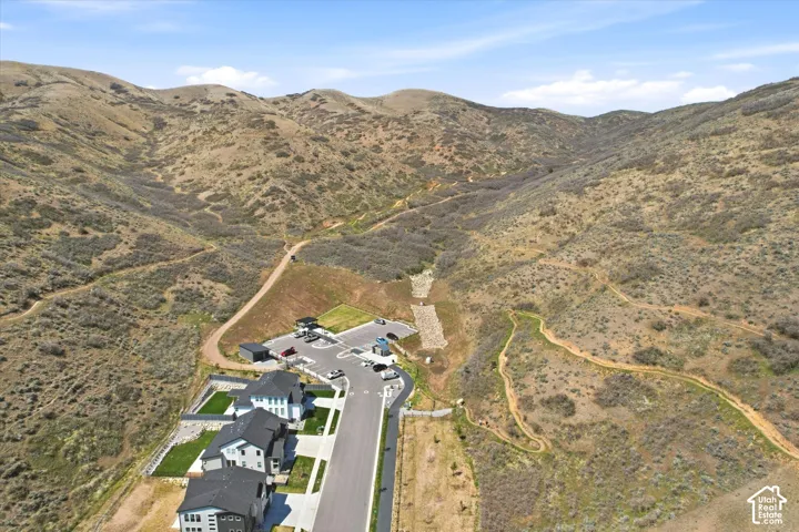 Newly constructed residences situated at the base of expansive, natural hillsides