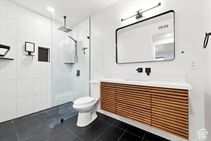 Floating wood-slat vanity with an integrated rectangular sink