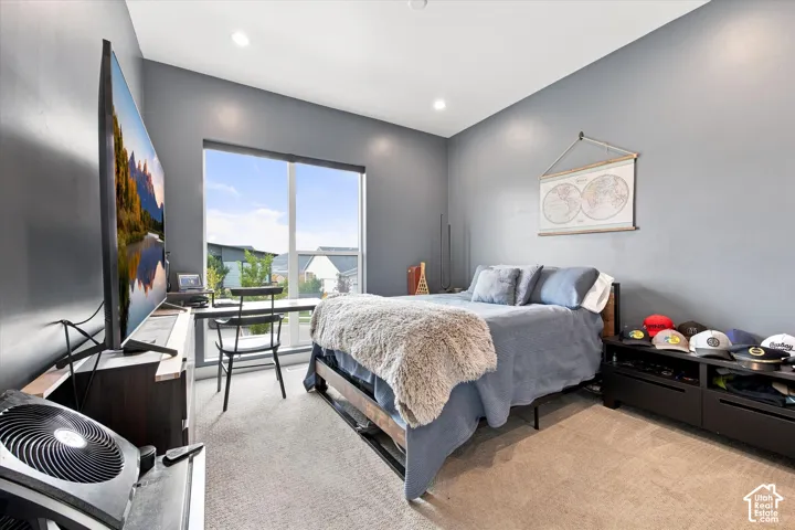 Recessed lighting and a large window provide illumination