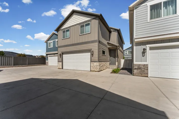 Contemporary exterior featuring horizontal siding, vertical siding, and stone accents