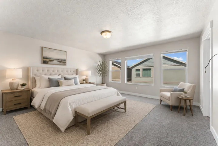 Spacious room featuring multiple windows, recessed lighting, and a textured ceiling