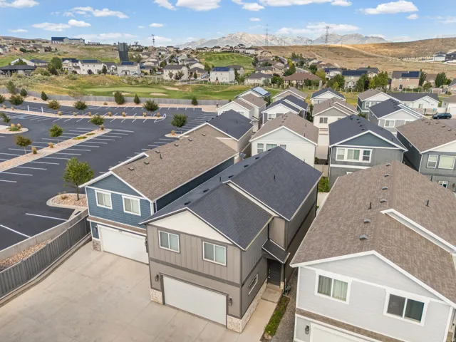 Contemporary multi-story residences with attached garages and asphalt shingle roofs
