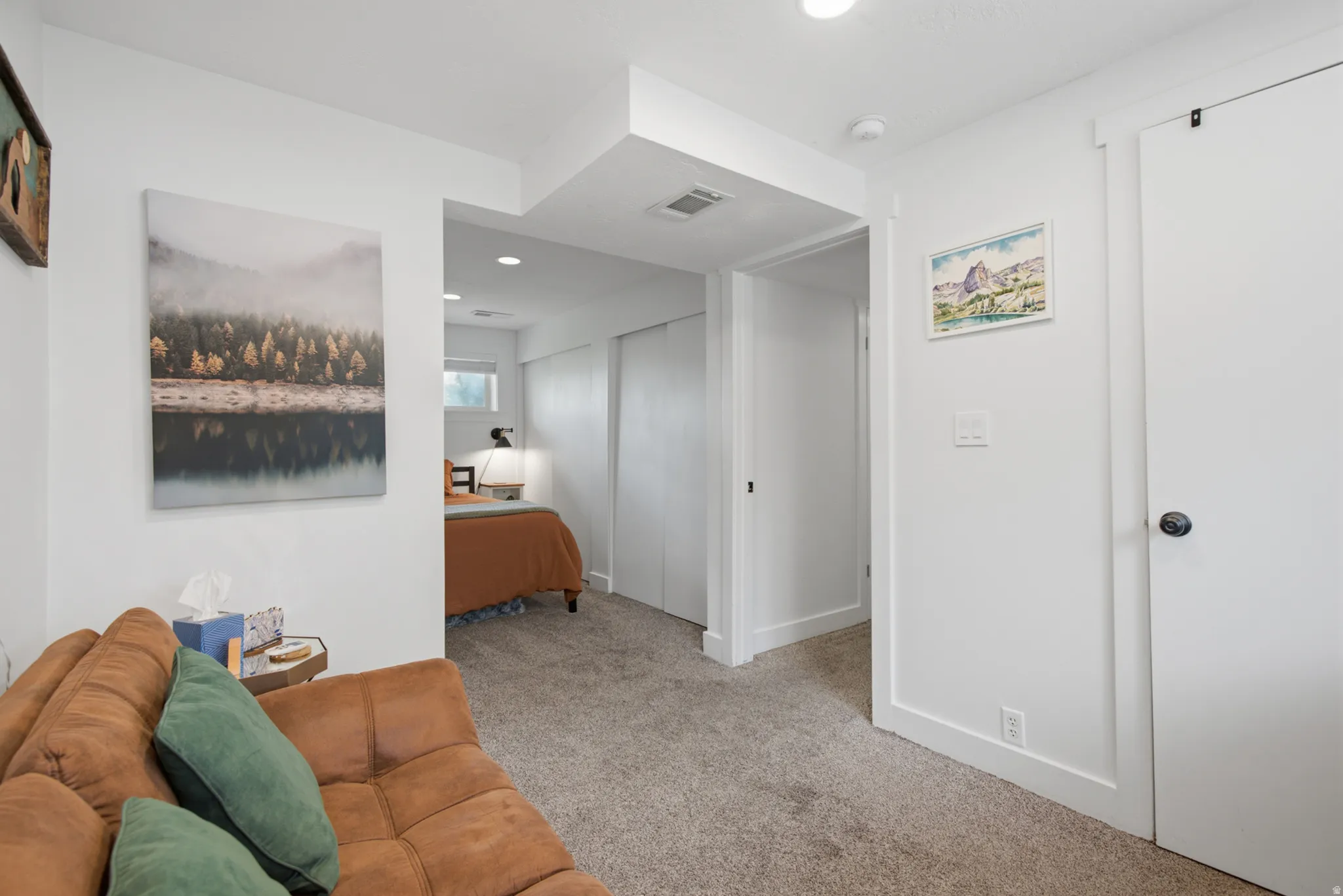Wall-to-wall carpeting with white trim molding