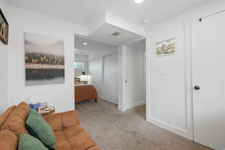 Wall-to-wall carpeting with white trim molding