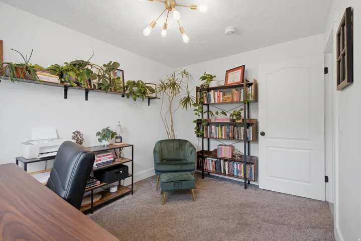 Recessed lighting, wood-finish shelving, and a modern light fixture