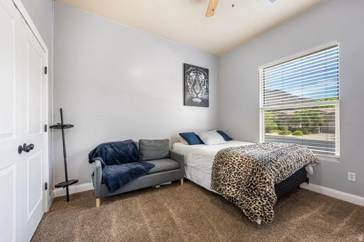 Neutral-toned walls complement plush carpeting