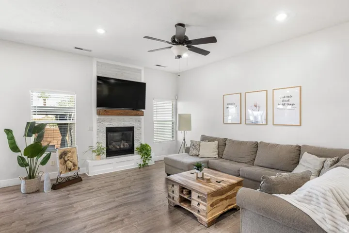 Wood-finish flooring, recessed lighting, and a ceiling fan
