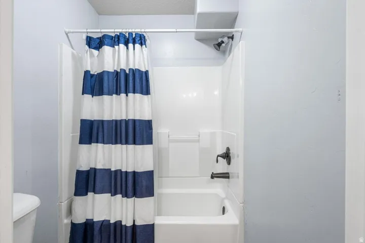 Bathtub and shower combination with matte black fixtures
