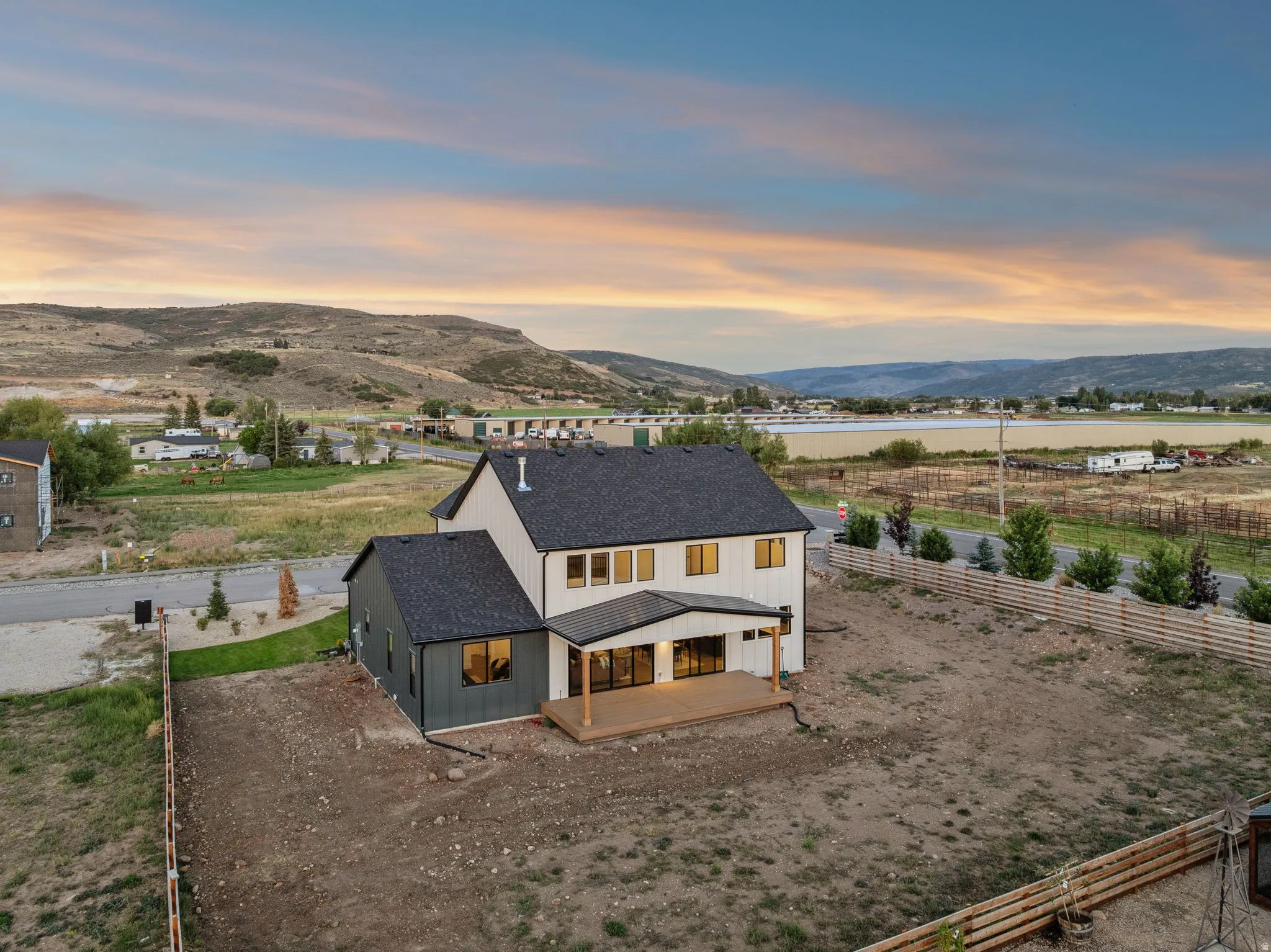 Contemporary architectural design with white vertical siding and dark gray accents